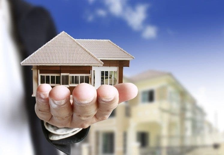 financing-residential-real-estate-invesments-man-holding