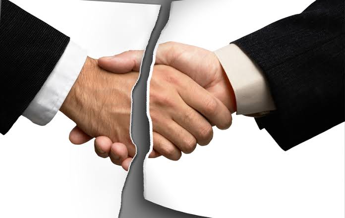 partnership disputes graphic showing paper handshake cutout