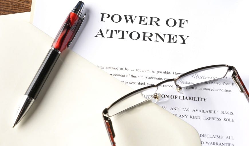 power-of-attorney-photo-of-document-with-pen-glasses