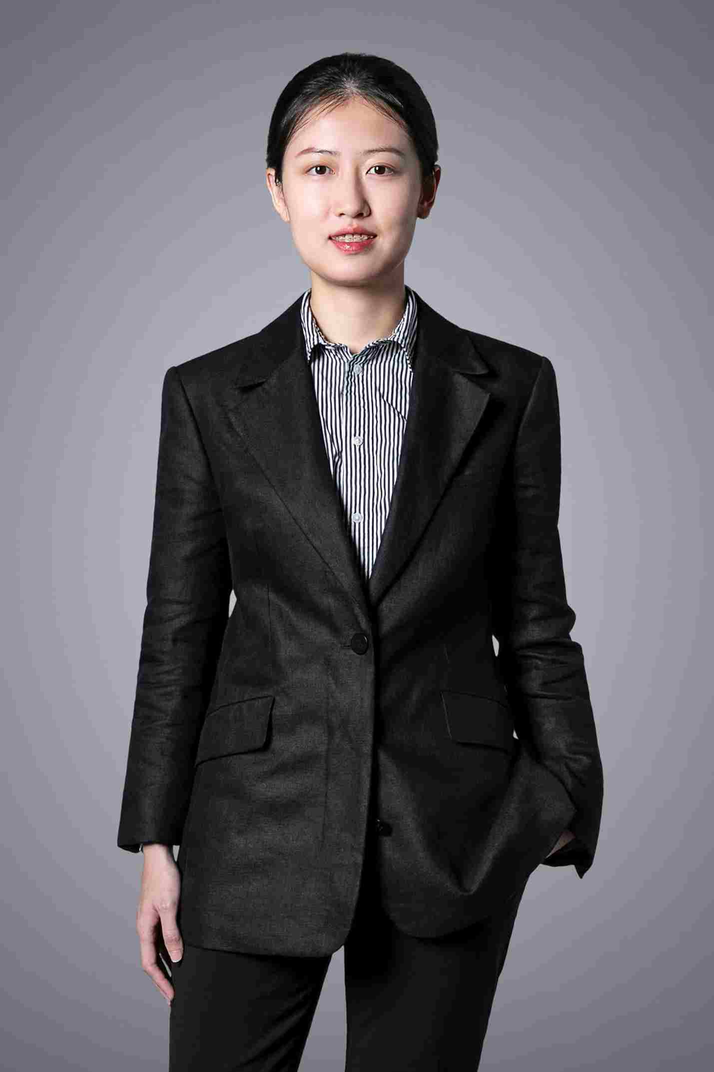 Smartly dressed individual in formal attire.